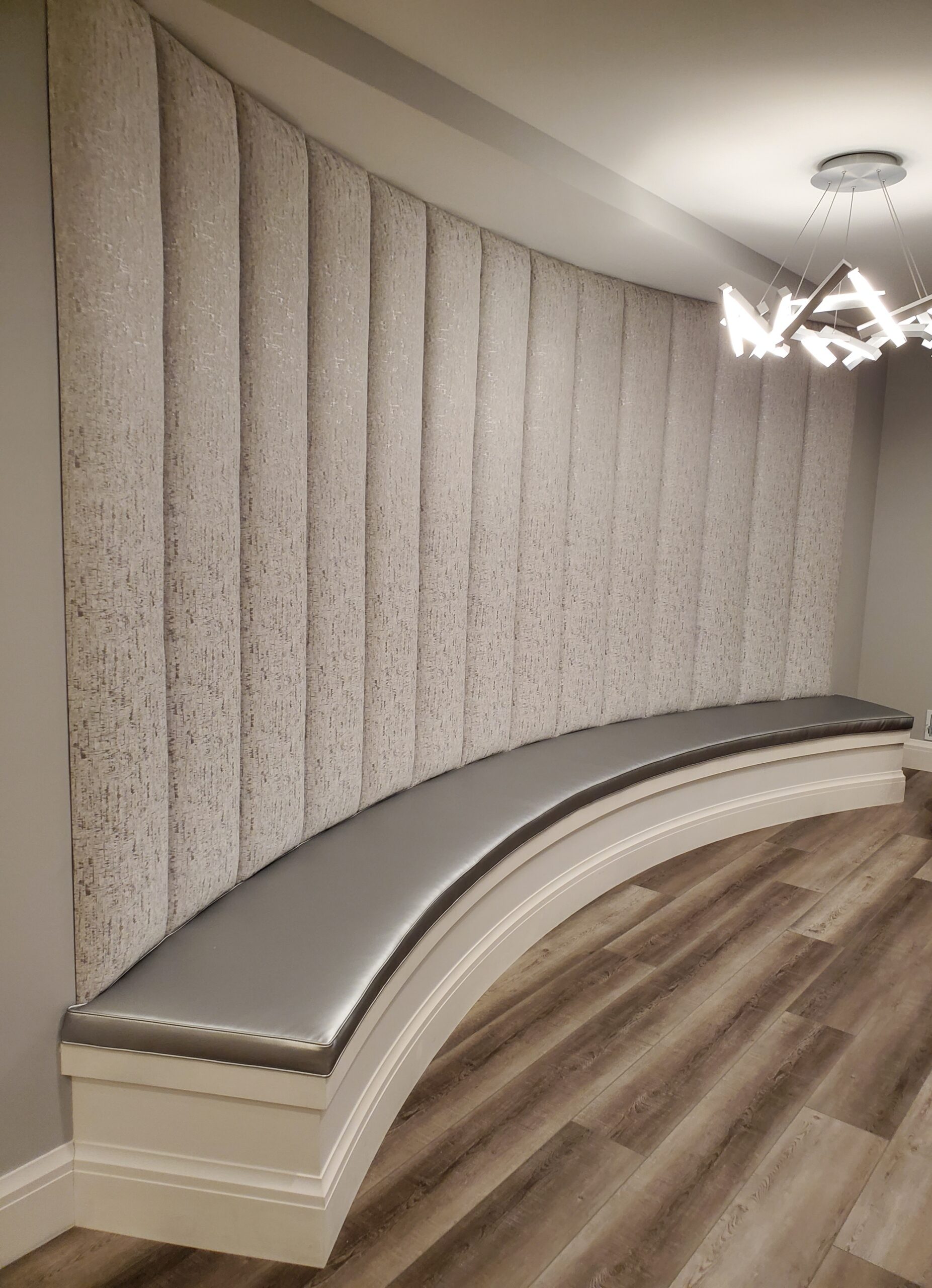 Curved upholster bench with wall panels