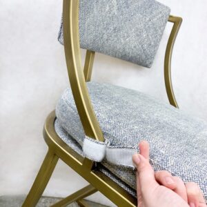 grey chair with Velcro to hold in place